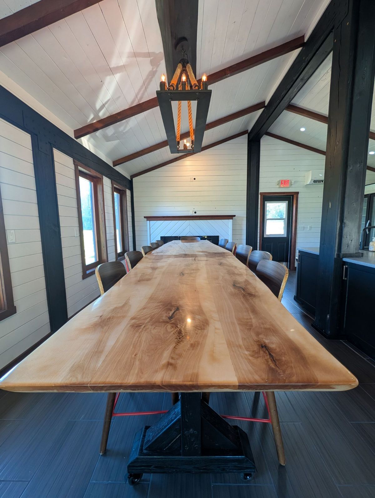 Live-edge communal table inside the Timber Lodge